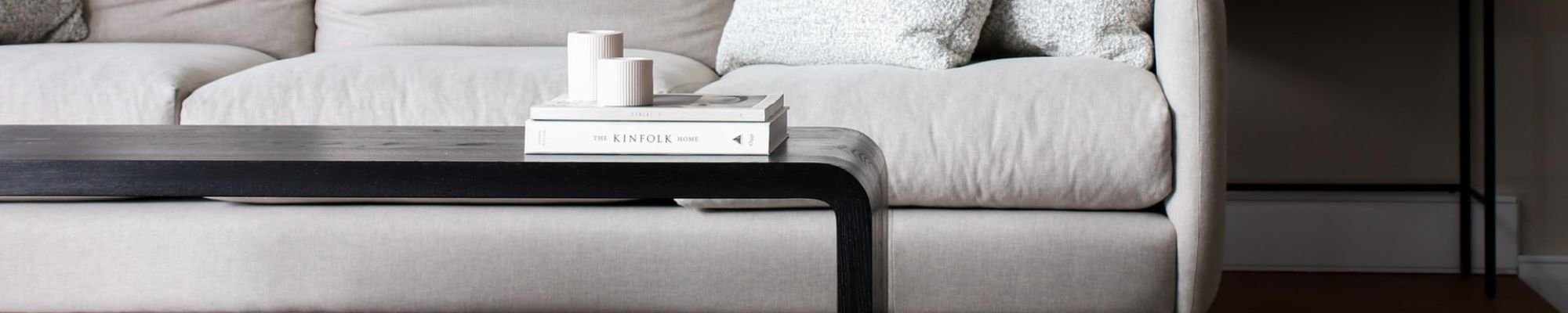 white couch and black coffee table on a brown hardwood floor from Walt Smith's Flooring Company in O'Fallon, MO